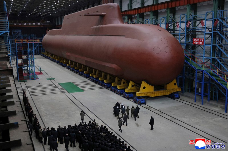 North Korean leader Kim Jong Un visits the construction site of an 8,700-ton nuclear-powered submarine capable of launching surface-to-air missiles in this picture released by North Korea's official Korean Central News Agency on December 25, 2025. KCNA via REUTERS    ATTENTION EDITORS - THIS IMAGE WAS PROVIDED BY A THIRD PARTY. REUTERS IS UNABLE TO INDEPENDENTLY VERIFY THIS IMAGE. NO THIRD PARTY SALES. SOUTH KOREA OUT. NO COMMERCIAL OR EDITORIAL SALES IN SOUTH KOREA.