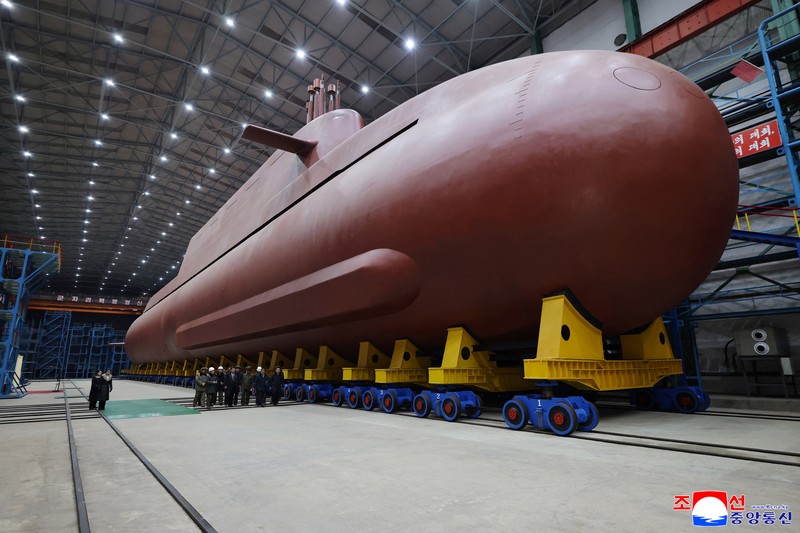 North Korean leader Kim Jong Un visits the construction site of an 8,700-ton nuclear-powered submarine capable of launching surface-to-air missiles in this picture released by North Korea's official Korean Central News Agency on December 25, 2025. KCNA via REUTERS    ATTENTION EDITORS - THIS IMAGE WAS PROVIDED BY A THIRD PARTY. REUTERS IS UNABLE TO INDEPENDENTLY VERIFY THIS IMAGE. NO THIRD PARTY SALES. SOUTH KOREA OUT. NO COMMERCIAL OR EDITORIAL SALES IN SOUTH KOREA.