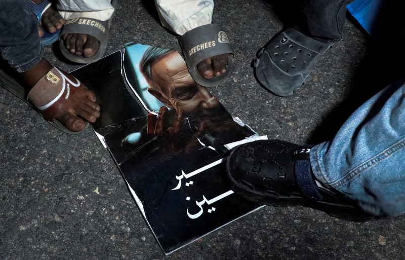 A demonstrator points to the white five‑pointed star on the Somali flag as Somalis attend a demonstration after Israel became the first country to formally recognise the self‑declared Republic of Somaliland as an independent and sovereign state, a decision that could reshape regional dynamics and test Somalia's longstanding opposition to secession, in the Hodan district of Mogadishu, Somalia, December 28, 2025. REUTERS/Feisal Omar