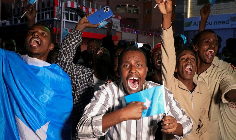 A demonstrator points to the white five‑pointed star on the Somali flag as Somalis attend a demonstration after Israel became the first country to formally recognise the self‑declared Republic of Somaliland as an independent and sovereign state, a decision that could reshape regional dynamics and test Somalia's longstanding opposition to secession, in the Hodan district of Mogadishu, Somalia, December 28, 2025. REUTERS/Feisal Omar