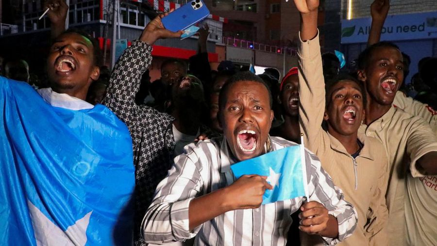 A demonstrator points to the white five‑pointed star on the Somali flag as Somalis attend a demonstration after Israel became the first country to formally recognise the self‑declared Republic of Somaliland as an independent and sovereign state, a decision that could reshape regional dynamics and test Somalia's longstanding opposition to secession, in the Hodan district of Mogadishu, Somalia, December 28, 2025. REUTERS/Feisal Omar