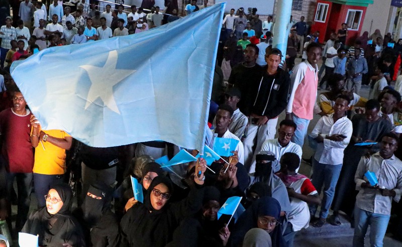 A demonstrator points to the white five‑pointed star on the Somali flag as Somalis attend a demonstration after Israel became the first country to formally recognise the self‑declared Republic of Somaliland as an independent and sovereign state, a decision that could reshape regional dynamics and test Somalia's longstanding opposition to secession, in the Hodan district of Mogadishu, Somalia, December 28, 2025. REUTERS/Feisal Omar