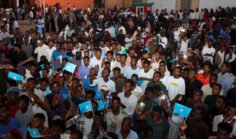A demonstrator points to the white five‑pointed star on the Somali flag as Somalis attend a demonstration after Israel became the first country to formally recognise the self‑declared Republic of Somaliland as an independent and sovereign state, a decision that could reshape regional dynamics and test Somalia's longstanding opposition to secession, in the Hodan district of Mogadishu, Somalia, December 28, 2025. REUTERS/Feisal Omar
