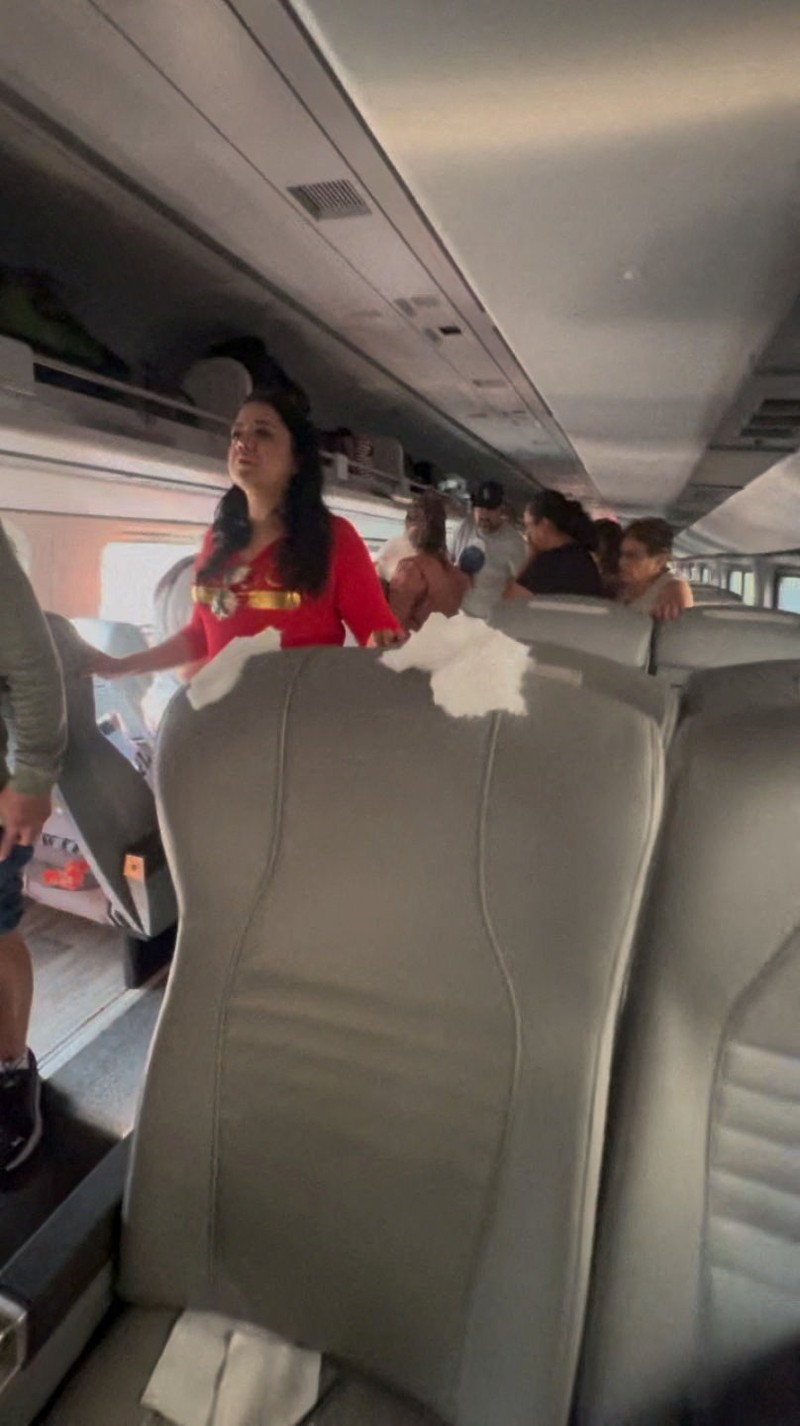 Passengers gather by the rail tracks at the site of a train derailment on the Interoceanic Corridor of the Isthmus of Tehuantepec, a railway line connecting Mexico's Pacific and Gulf coasts, where several passengers were killed and injured near Nizanda, Oaxaca state, Mexico December 28, 2025 in this screen grab obtained from social media video. Video obtained by Reuters/via REUTERS  THIS IMAGE HAS BEEN SUPPLIED BY A THIRD PARTY. NO RESALES. NO ARCHIVES.