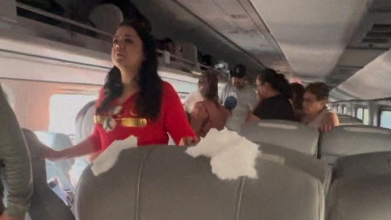 Passengers gather by the rail tracks at the site of a train derailment on the Interoceanic Corridor of the Isthmus of Tehuantepec, a railway line connecting Mexico's Pacific and Gulf coasts, where several passengers were killed and injured near Nizanda, Oaxaca state, Mexico December 28, 2025 in this screen grab obtained from social media video. Video obtained by Reuters/via REUTERS  THIS IMAGE HAS BEEN SUPPLIED BY A THIRD PARTY. NO RESALES. NO ARCHIVES.