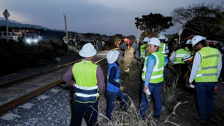 Passengers gather by the rail tracks at the site of a train derailment on the Interoceanic Corridor of the Isthmus of Tehuantepec, a railway line connecting Mexico's Pacific and Gulf coasts, where several passengers were killed and injured near Nizanda, Oaxaca state, Mexico December 28, 2025 in this screen grab obtained from social media video. Video obtained by Reuters/via REUTERS  THIS IMAGE HAS BEEN SUPPLIED BY A THIRD PARTY. NO RESALES. NO ARCHIVES.