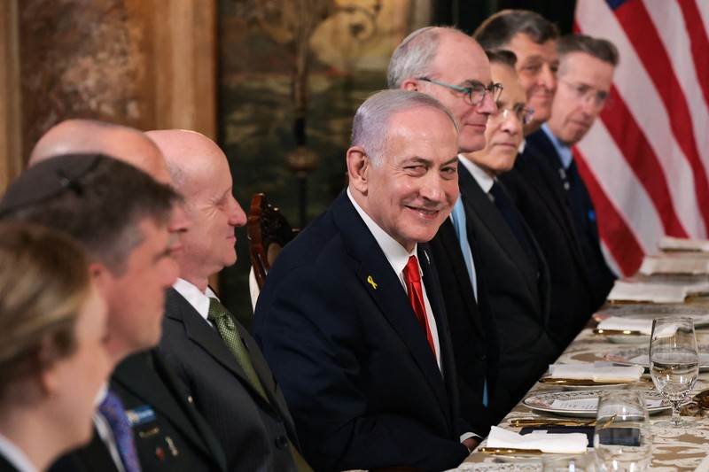 U.S. President Donald Trump greets Israeli Prime Minister Benjamin Netanyahu upon arrival for meetings at Trump's Mar-a-Lago club in Palm Beach, Florida, U.S., December 29, 2025. REUTERS/Jonathan Ernst