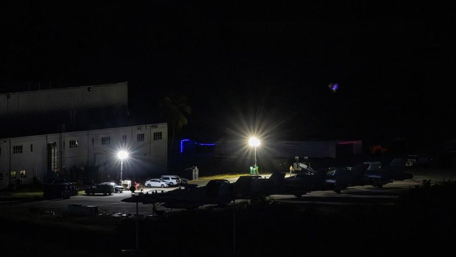 Personnel work on a U.S. Air Force F-35 Lightning II fighter jet parked on the tarmac at the former Roosevelt Roads naval base, amid tensions between the administration of U.S. President Donald Trump and the government of Venezuelan President Nicolas Maduro, in Ceiba, Puerto Rico, January 2, 2026. REUTERS/Eva Marie Uzcategui