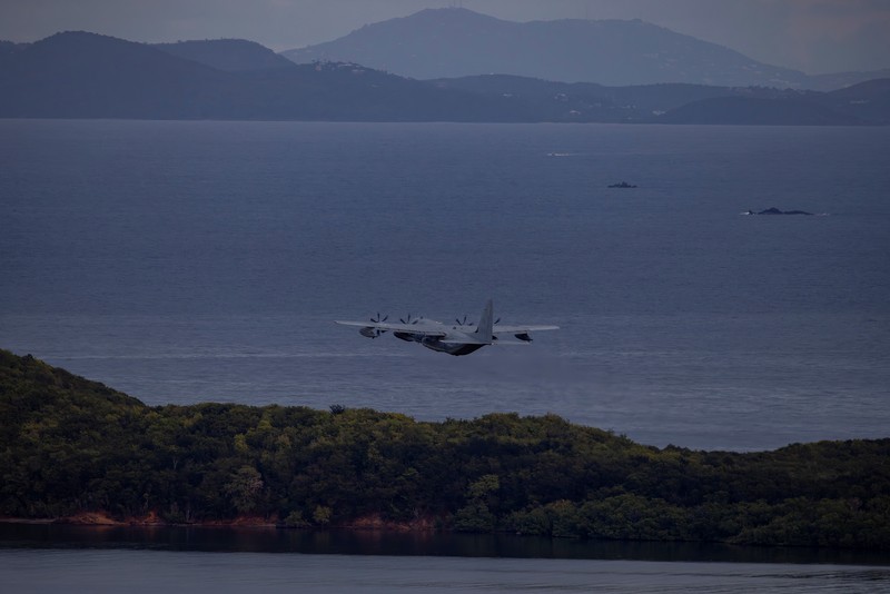 Personnel work on a U.S. Air Force F-35 Lightning II fighter jet parked on the tarmac at the former Roosevelt Roads naval base, amid tensions between the administration of U.S. President Donald Trump and the government of Venezuelan President Nicolas Maduro, in Ceiba, Puerto Rico, January 2, 2026. REUTERS/Eva Marie Uzcategui