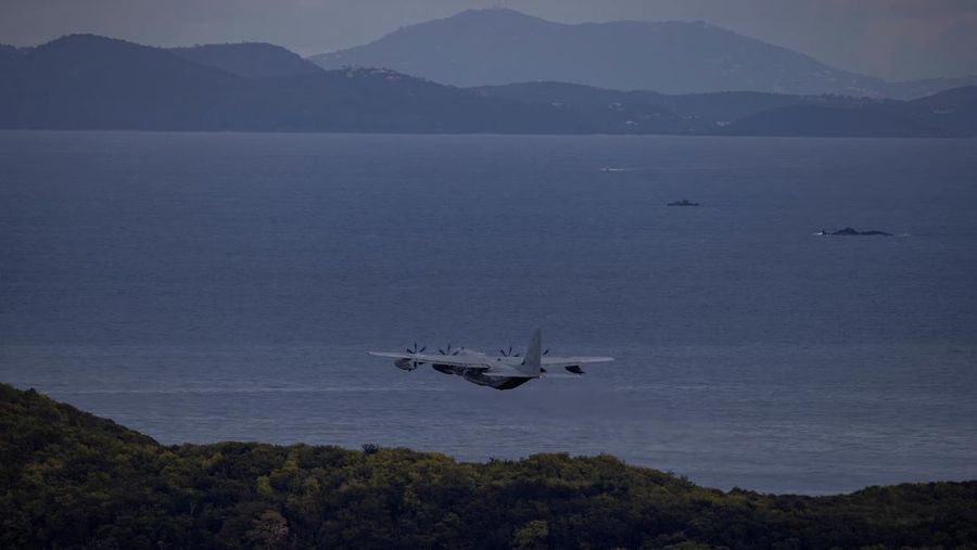 Personnel work on a U.S. Air Force F-35 Lightning II fighter jet parked on the tarmac at the former Roosevelt Roads naval base, amid tensions between the administration of U.S. President Donald Trump and the government of Venezuelan President Nicolas Maduro, in Ceiba, Puerto Rico, January 2, 2026. REUTERS/Eva Marie Uzcategui