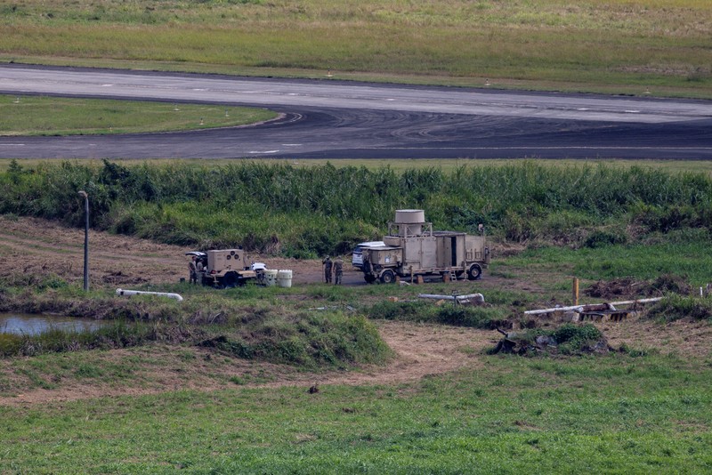 Personnel work on a U.S. Air Force F-35 Lightning II fighter jet parked on the tarmac at the former Roosevelt Roads naval base, amid tensions between the administration of U.S. President Donald Trump and the government of Venezuelan President Nicolas Maduro, in Ceiba, Puerto Rico, January 2, 2026. REUTERS/Eva Marie Uzcategui