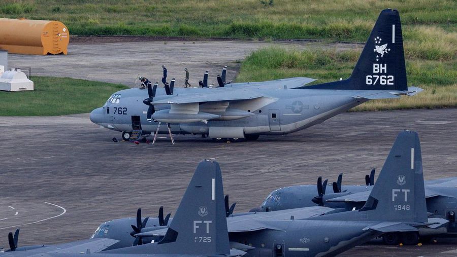 Personnel work on a U.S. Air Force F-35 Lightning II fighter jet parked on the tarmac at the former Roosevelt Roads naval base, amid tensions between the administration of U.S. President Donald Trump and the government of Venezuelan President Nicolas Maduro, in Ceiba, Puerto Rico, January 2, 2026. REUTERS/Eva Marie Uzcategui