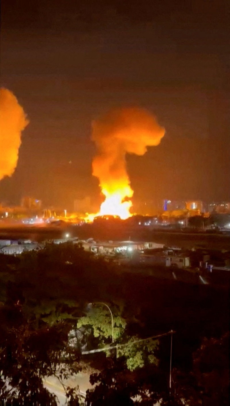 Helicopters fly past plumes of smoke rising from explosions, in Caracas, Venezuela, January 3, 2026 in this screen grab obtained from video obtained by Reuters. Video Obtained by Reuters/via REUTERS  THIS IMAGE HAS BEEN SUPPLIED BY A THIRD PARTY. NO RESALES. NO ARCHIVES. NEWS USE ONLY. THIS PICTURE WAS PROCESSED BY REUTERS TO ENHANCE QUALITY. AN UNPROCESSED VERSION HAS BEEN PROVIDED SEPARATELY.  VERIFICATION: - Mountains, towers and buildings match satellite and file imagery of Caracas  - Date verified by multiple corroborating videos of strikes on Caracas      TPX IMAGES OF THE DAY