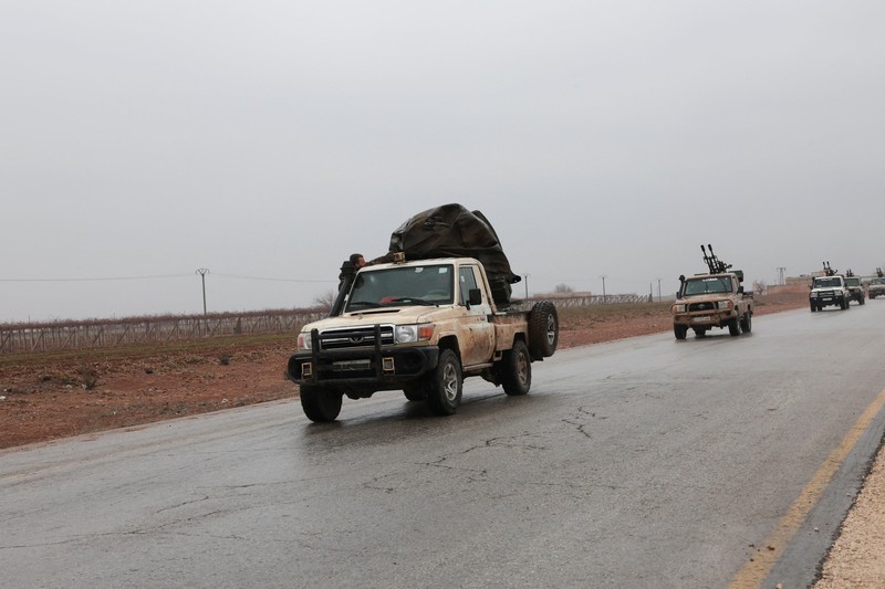 Soldiers in military vehicles on a road to Dayr Hafir east of Aleppo, after a Kurdish-led Syrian Democratic Forces (SDF) withdrawal from the area and its takeover by the Syrian army, in Aleppo, Syria, January 17, 2026. REUTERS/Mahmoud Hassano