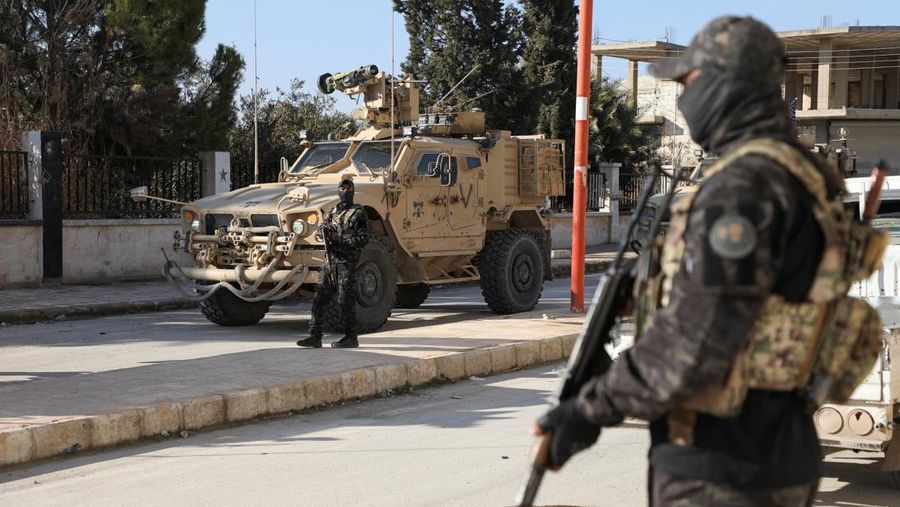 Soldiers in military vehicles on a road to Dayr Hafir east of Aleppo, after a Kurdish-led Syrian Democratic Forces (SDF) withdrawal from the area and its takeover by the Syrian army, in Aleppo, Syria, January 17, 2026. REUTERS/Mahmoud Hassano