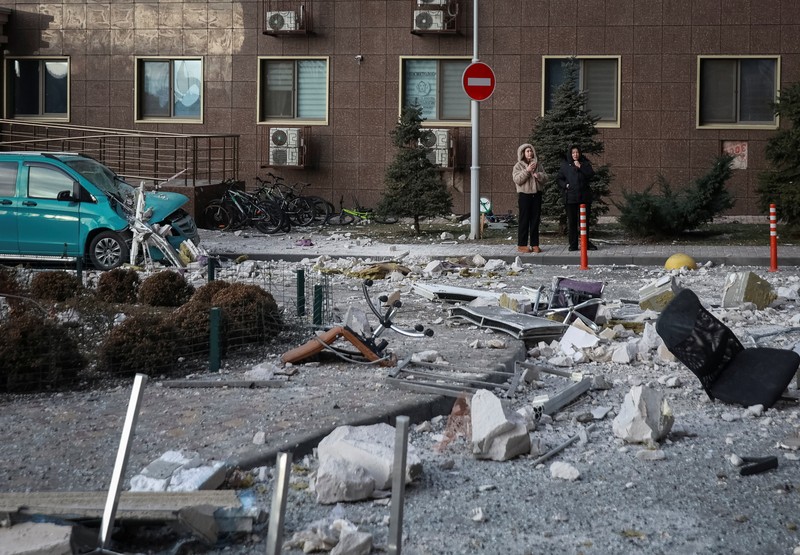 Residents walk at the site of the Russian drone strike, amid Russia's attack on Ukraine, in Odesa, Ukraine January 19, 2026. REUTERS/Nina Liashonok     TPX IMAGES OF THE DAY