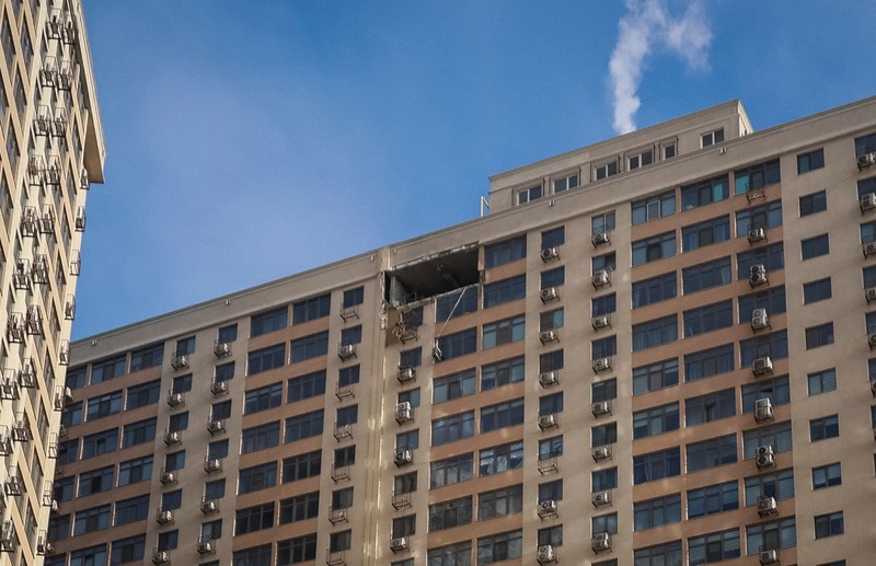 Residents walk at the site of the Russian drone strike, amid Russia's attack on Ukraine, in Odesa, Ukraine January 19, 2026. REUTERS/Nina Liashonok     TPX IMAGES OF THE DAY