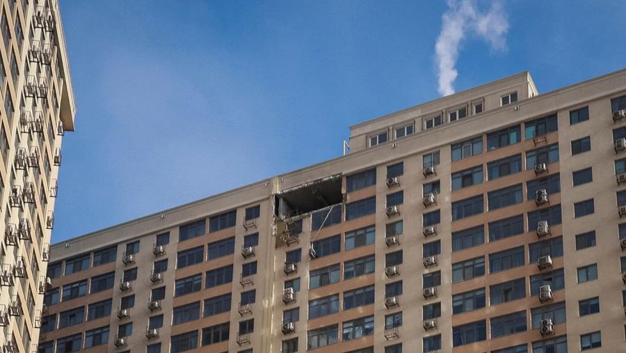 Residents walk at the site of the Russian drone strike, amid Russia's attack on Ukraine, in Odesa, Ukraine January 19, 2026. REUTERS/Nina Liashonok     TPX IMAGES OF THE DAY