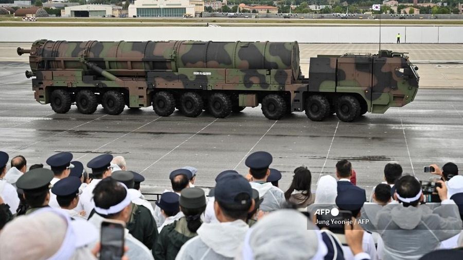 Visitors watch South Korea's Hyunmoo-5 missile during a ceremony to mark the 76th anniversary of Korea Armed Forces Day at Seoul Air Base in Seongnam on October 1, 2024. (Photo by Jung Yeon-je / AFP)