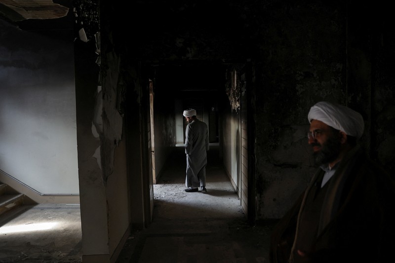 Bus-bus yang dibakar selama protes di Iran, di Teheran, Iran, 21 Januari 2026. (Majid Asgaripour/WANA (West Asia News Agency) via REUTERS)
