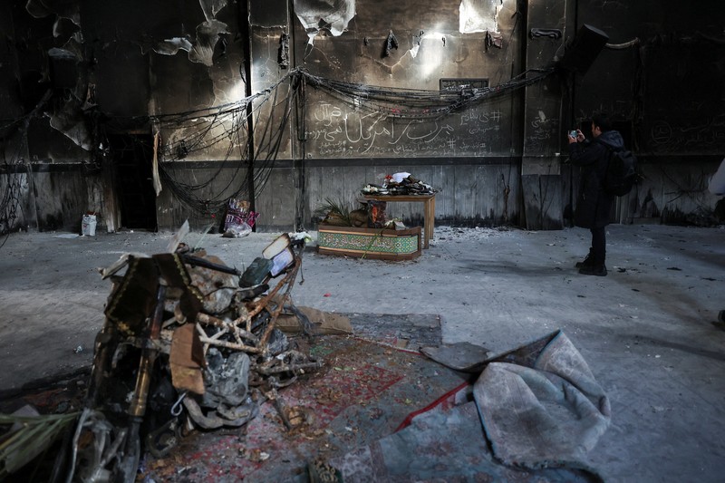 Bus-bus yang dibakar selama protes di Iran, di Teheran, Iran, 21 Januari 2026. (Majid Asgaripour/WANA (West Asia News Agency) via REUTERS)