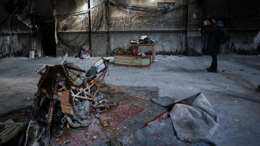 Bus-bus yang dibakar selama protes di Iran, di Teheran, Iran, 21 Januari 2026. (Majid Asgaripour/WANA (West Asia News Agency) via REUTERS)