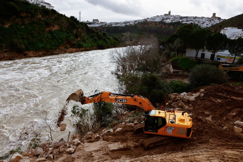 A drone view shows an isolated farm, surrounded by water, where ten thoroughbred horses and some dogs, which have gone for two days without being fed, wait for help, due to the Guadalete River overflowing, after heavy rains, as Storm Marta hits parts of Spain, in Jerez de la Frontera, Spain, February 8, 2026. REUTERS/Guillermo Martinez