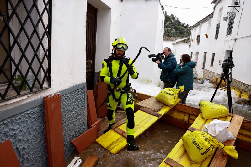 A drone view shows an isolated farm, surrounded by water, where ten thoroughbred horses and some dogs, which have gone for two days without being fed, wait for help, due to the Guadalete River overflowing, after heavy rains, as Storm Marta hits parts of Spain, in Jerez de la Frontera, Spain, February 8, 2026. REUTERS/Guillermo Martinez