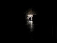Thai military personnel and journalists walk in a corridor inside a compound in O'Smach used for scam operations on a field trip, at the Chong Chom-O'Smach border crossing, which was bombed and occupied by the Thai military in December following clas
