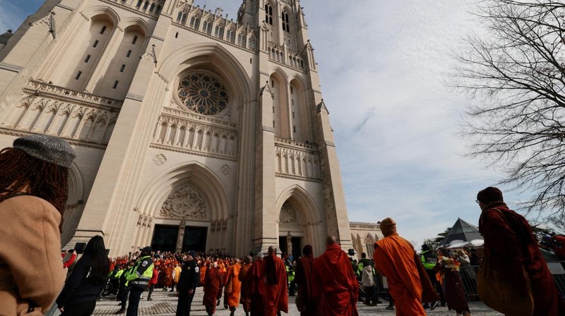 A group of Buddhist monks on the 2,300 mile &ldquo;Walk for Peace&rdquo; walk along Massachusetts Avenue at Embassy Row, in Washington, D.C., U.S, February 10, 2026. REUTERS/Evelyn Hockstein     TPX IMAGES OF THE DAY