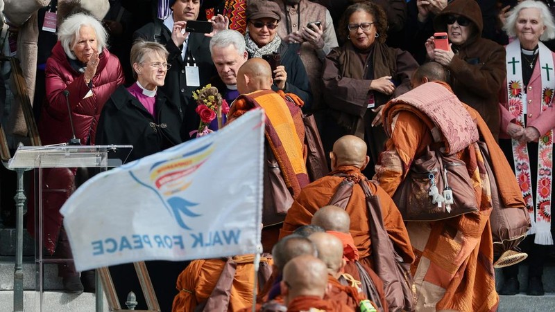 A group of Buddhist monks on the 2,300 mile &ldquo;Walk for Peace&rdquo; walk along Massachusetts Avenue at Embassy Row, in Washington, D.C., U.S, February 10, 2026. REUTERS/Evelyn Hockstein     TPX IMAGES OF THE DAY