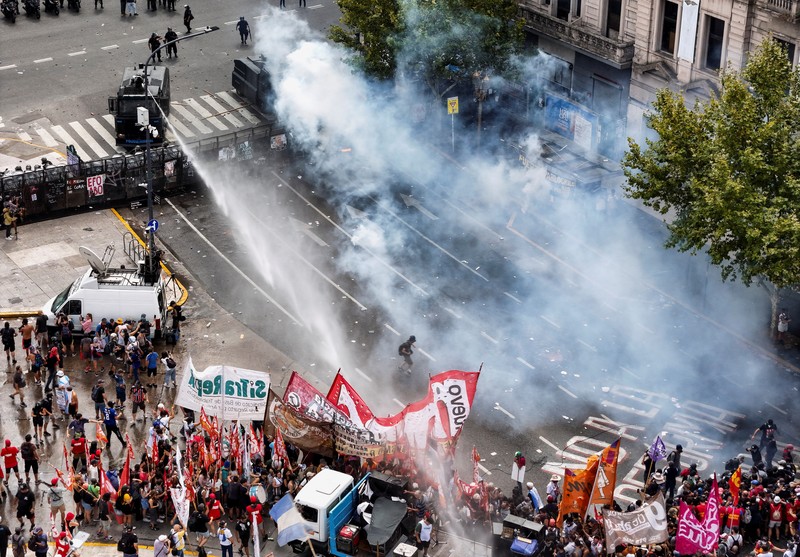 A drone view shows riot police clashing with union members protesting outside the National Congress as members of Argentina's Senate discuss labour reforms proposed by President Javier Milei's libertarian government to attract investment and revive growth, while labour groups say it would roll back workers' rights, in Buenos Aires, Argentina, February 11, 2026. REUTERS/Martin Cossarini