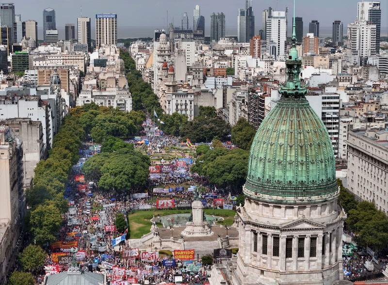 A drone view shows riot police clashing with union members protesting outside the National Congress as members of Argentina's Senate discuss labour reforms proposed by President Javier Milei's libertarian government to attract investment and revive growth, while labour groups say it would roll back workers' rights, in Buenos Aires, Argentina, February 11, 2026. REUTERS/Martin Cossarini