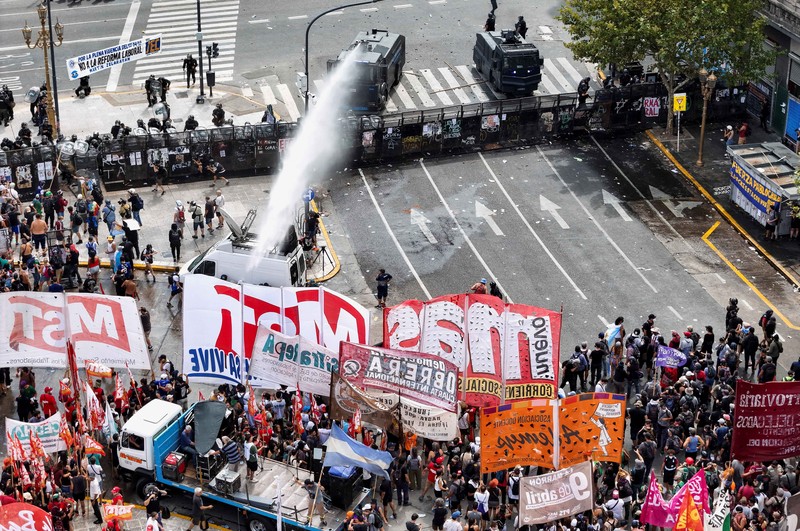 A drone view shows riot police clashing with union members protesting outside the National Congress as members of Argentina's Senate discuss labour reforms proposed by President Javier Milei's libertarian government to attract investment and revive growth, while labour groups say it would roll back workers' rights, in Buenos Aires, Argentina, February 11, 2026. REUTERS/Martin Cossarini