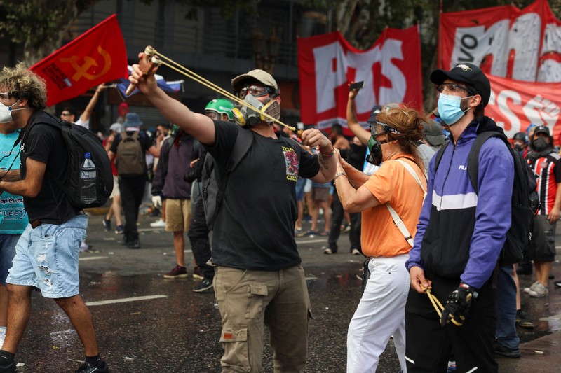 A drone view shows riot police clashing with union members protesting outside the National Congress as members of Argentina's Senate discuss labour reforms proposed by President Javier Milei's libertarian government to attract investment and revive growth, while labour groups say it would roll back workers' rights, in Buenos Aires, Argentina, February 11, 2026. REUTERS/Martin Cossarini