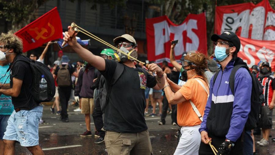 A drone view shows riot police clashing with union members protesting outside the National Congress as members of Argentina's Senate discuss labour reforms proposed by President Javier Milei's libertarian government to attract investment and revive growth, while labour groups say it would roll back workers' rights, in Buenos Aires, Argentina, February 11, 2026. REUTERS/Martin Cossarini