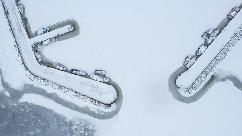 A drone view of the frozen Puck Bay and the harbour in Jastarnia, Poland, February 14, 2026. REUTERS/Lukasz Glowala