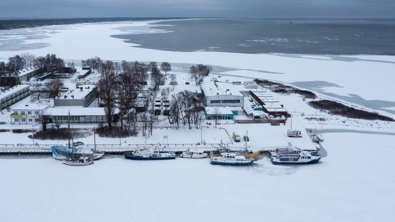 A drone view of the frozen Puck Bay and the harbour in Jastarnia, Poland, February 14, 2026. REUTERS/Lukasz Glowala