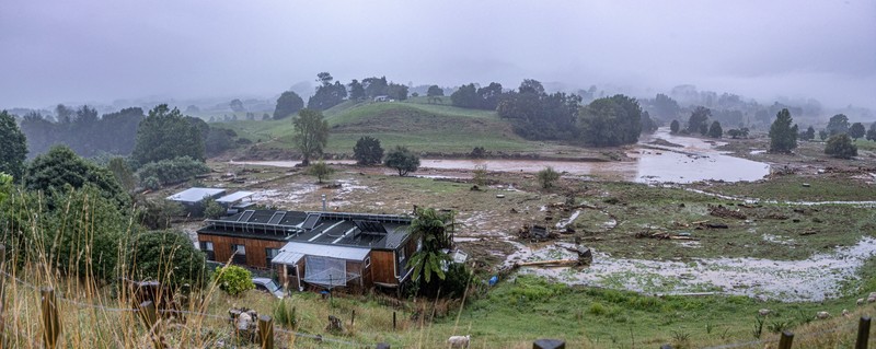 A man retrieves his gear from a utility vehicle that plunged off a collapsed section of road following heavy rain and wild winds in Puketotara, Waikato region, New Zealand, February 14, 2026 in this picture obtained from social media. Wayne Feisst/via REUTERS  THIS IMAGE HAS BEEN SUPPLIED BY A THIRD PARTY. MANDATORY CREDIT. NO RESALES. NO ARCHIVES.     TPX IMAGES OF THE DAY     VERIFICATION: Reuters was able to confirm the location of footage from terrain, road layout, vegetation and bridge seen from file and satellite images. Date of footage was confirmed from file data.