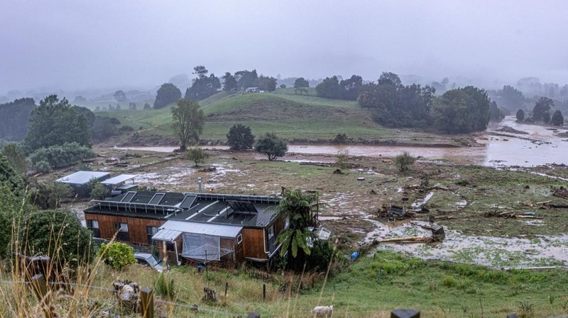 A man retrieves his gear from a utility vehicle that plunged off a collapsed section of road following heavy rain and wild winds in Puketotara, Waikato region, New Zealand, February 14, 2026 in this picture obtained from social media. Wayne Feisst/via REUTERS  THIS IMAGE HAS BEEN SUPPLIED BY A THIRD PARTY. MANDATORY CREDIT. NO RESALES. NO ARCHIVES.     TPX IMAGES OF THE DAY     VERIFICATION: Reuters was able to confirm the location of footage from terrain, road layout, vegetation and bridge seen from file and satellite images. Date of footage was confirmed from file data.