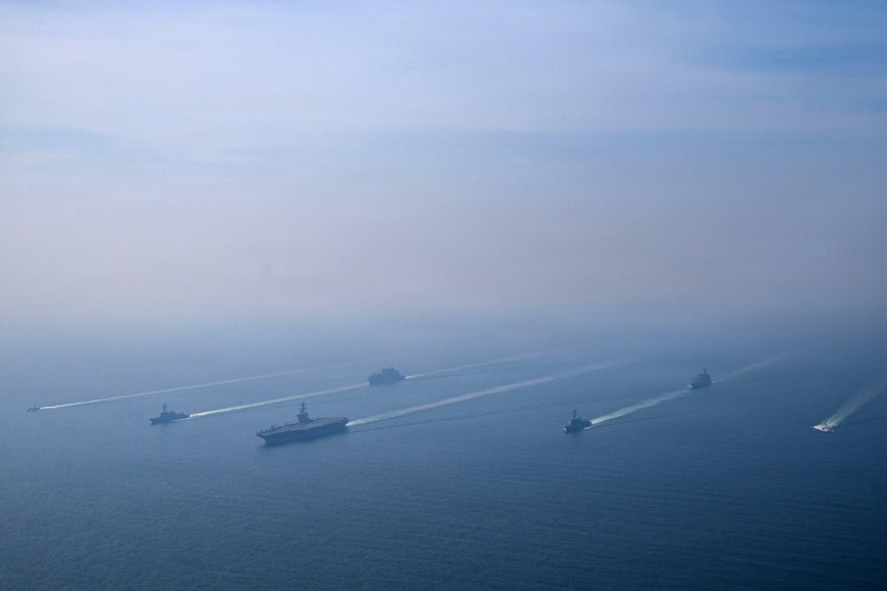 The U.S. Navy's Nimitz-class aircraft carrier USS Abraham Lincoln, Arleigh Burke-class guided-missile destroyer USS Frank E. Petersen Jr. and Lewis and Clark-class dry cargo ship USNS Carl Brashear sail during a photo exercise in the Arabian Sea, February 6, 2026.  U.S. Navy/Mass Communication Specialist 1st Class Jesse Monford/Handout via REUTERS THIS IMAGE HAS BEEN SUPPLIED BY A THIRD PARTY