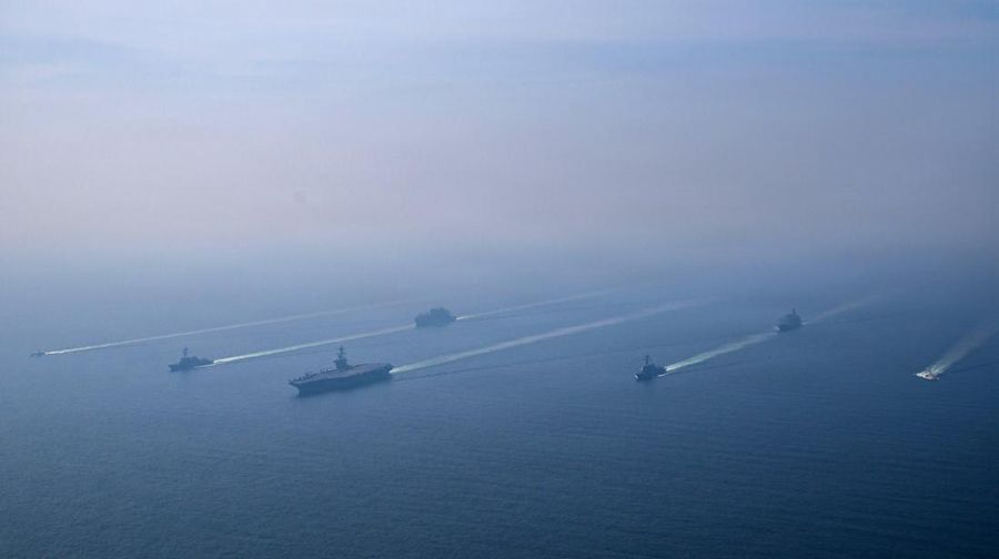 The U.S. Navy's Nimitz-class aircraft carrier USS Abraham Lincoln, Arleigh Burke-class guided-missile destroyer USS Frank E. Petersen Jr. and Lewis and Clark-class dry cargo ship USNS Carl Brashear sail during a photo exercise in the Arabian Sea, February 6, 2026.  U.S. Navy/Mass Communication Specialist 1st Class Jesse Monford/Handout via REUTERS THIS IMAGE HAS BEEN SUPPLIED BY A THIRD PARTY