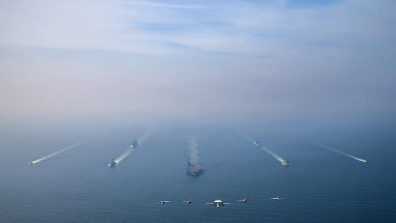 The U.S. Navy's Nimitz-class aircraft carrier USS Abraham Lincoln, Arleigh Burke-class guided-missile destroyer USS Frank E. Petersen Jr. and Lewis and Clark-class dry cargo ship USNS Carl Brashear sail during a photo exercise in the Arabian Sea, February 6, 2026.  U.S. Navy/Mass Communication Specialist 1st Class Jesse Monford/Handout via REUTERS THIS IMAGE HAS BEEN SUPPLIED BY A THIRD PARTY