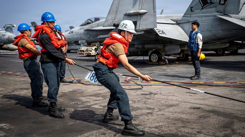The U.S. Navy's Nimitz-class aircraft carrier USS Abraham Lincoln, Arleigh Burke-class guided-missile destroyer USS Frank E. Petersen Jr. and Lewis and Clark-class dry cargo ship USNS Carl Brashear sail during a photo exercise in the Arabian Sea, February 6, 2026.  U.S. Navy/Mass Communication Specialist 1st Class Jesse Monford/Handout via REUTERS THIS IMAGE HAS BEEN SUPPLIED BY A THIRD PARTY