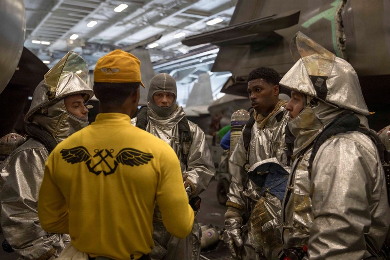 The U.S. Navy's Nimitz-class aircraft carrier USS Abraham Lincoln, Arleigh Burke-class guided-missile destroyer USS Frank E. Petersen Jr. and Lewis and Clark-class dry cargo ship USNS Carl Brashear sail during a photo exercise in the Arabian Sea, February 6, 2026.  U.S. Navy/Mass Communication Specialist 1st Class Jesse Monford/Handout via REUTERS THIS IMAGE HAS BEEN SUPPLIED BY A THIRD PARTY