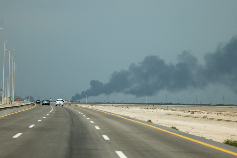 Workers evacuate area around Saudi Aramco's Ras Tanura oil refinery as smoke rises following a reported Iranian drone strike, in Ras Tanura, Saudi Arabia, in this still image obtained from social media video released on March 2, 2026. Social Media/via REUTERS  THIS IMAGE HAS BEEN SUPPLIED BY A THIRD PARTY. NO RESALES. NO ARCHIVES. NEWS USE ONLY. VERIFICATION: Reuters verified the location from the buildings, trees and the smoke stacks seen in the video, which matched satellite imagery of the area. The date was verified from an official statement from Aramco saying it had shut the facility down after a drone strike on March 2. No older versions of the videos were found posted online before March 2. Coordinates: 26.70322602981727, 50.090750650948635.
