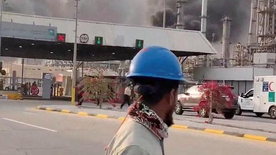 Workers evacuate area around Saudi Aramco's Ras Tanura oil refinery as smoke rises following a reported Iranian drone strike, in Ras Tanura, Saudi Arabia, in this still image obtained from social media video released on March 2, 2026. Social Media/via REUTERS  THIS IMAGE HAS BEEN SUPPLIED BY A THIRD PARTY. NO RESALES. NO ARCHIVES. NEWS USE ONLY. VERIFICATION: Reuters verified the location from the buildings, trees and the smoke stacks seen in the video, which matched satellite imagery of the area. The date was verified from an official statement from Aramco saying it had shut the facility down after a drone strike on March 2. No older versions of the videos were found posted online before March 2. Coordinates: 26.70322602981727, 50.090750650948635.