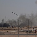 Asap mengepul dari serangan Iran yang dilaporkan terjadi di area tempat Kedutaan Besar AS berada di Kota Kuwait pada 2 Maret 2026. (AFP)