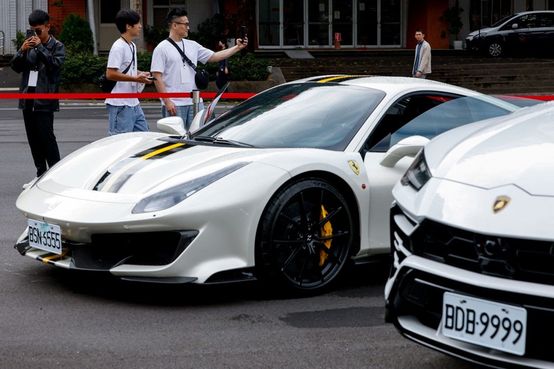 Luxury cars are on display, as Taiwan auctions off luxury cars linked to the Cambodian scam centre Prince Group, in Taipei, Taiwan, March 2, 2026. REUTERS/Ann Wang