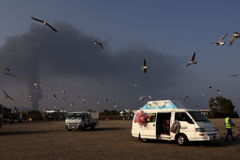 Smoke rises in the Fujairah oil industry zone following a fire caused by debris after interception of a drone by air defenses, according to the Fujairah media office, amid the U.S.-Israel conflict with Iran, in Fujairah, United Arab Emirates, March 3, 2026. REUTERS/Amr Alfiky